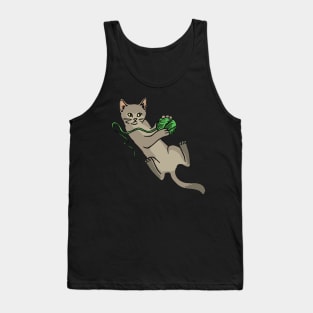 A cute cat playing with a green woolball Tank Top